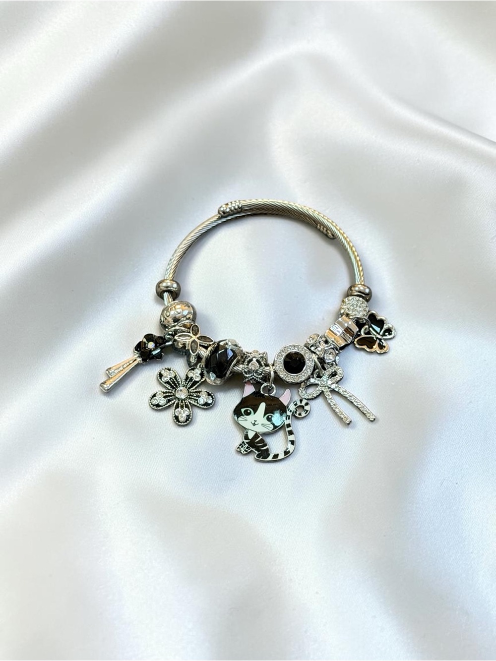 Silver-Tone Cat Charm Flower Twisted Bangle - Black and Silver